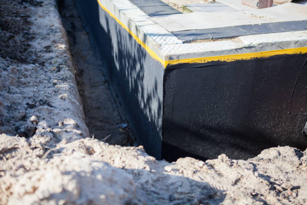 Professional Waterproofing technician working in Drayden, MD